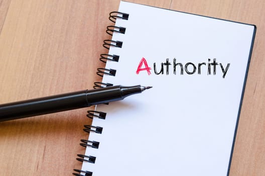 Authority text concept write on notebook