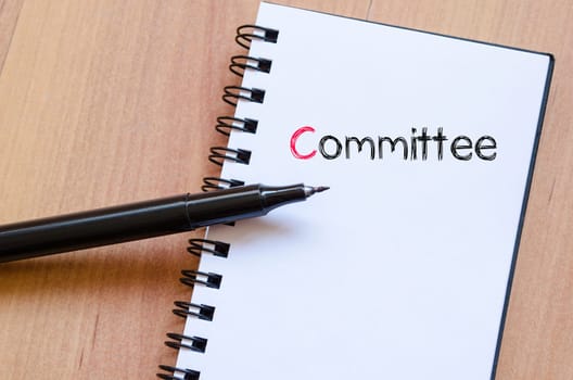 Committee text concept write on notebook