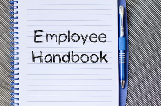 Employee handbook text concept write on notebook