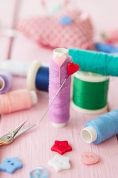 Colourful yarns,buttons and utensils
