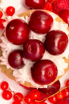 Cupcake with cherries shoot from upper angle
