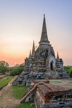 Ruins and pagoda ancient architecture of Wat Phra Si Sanphet old temple famous attractions during sunset at Phra Nakhon Si Ayutthaya Historical Park in Ayutthaya Province, Thailand