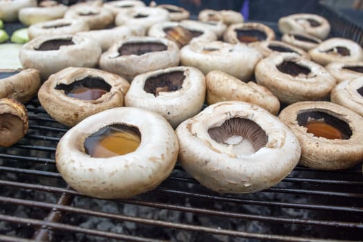 Tasty mushrooms grilled outside. Small depth of field