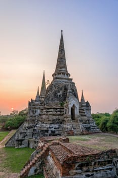 Ruins and pagoda ancient architecture of Wat Phra Si Sanphet old temple famous attractions during sunset at Phra Nakhon Si Ayutthaya Historical Park in Ayutthaya Province, Thailand