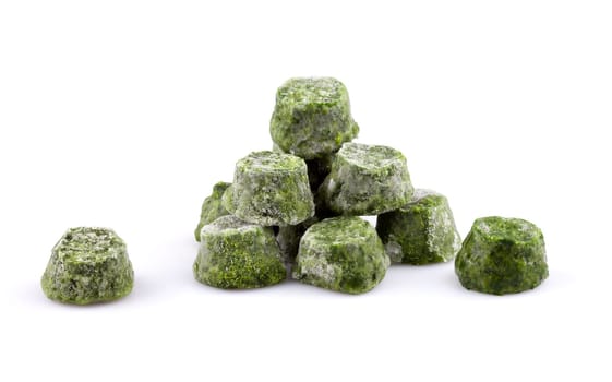 Frozen chopped spinach on white background.