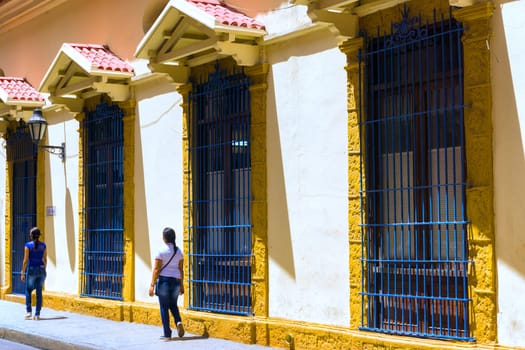 CARTAGENA, COLOMBA - MAY 23: People walk past old colonial buildings in Cartagena, Colombia on May 23, 2016