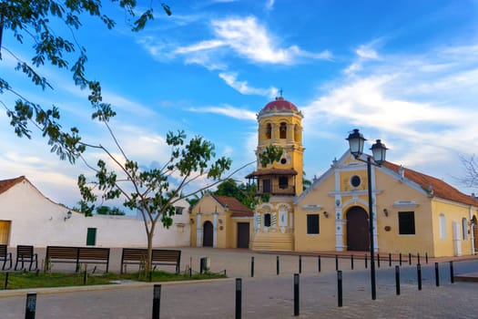 View of the yellow Santa Barbara church in Mompox, Colombia
