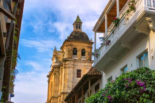 View of historic San Claver church in colonial balconies in Cartagena, Colombia