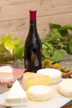 french cheese with a bottle of wine