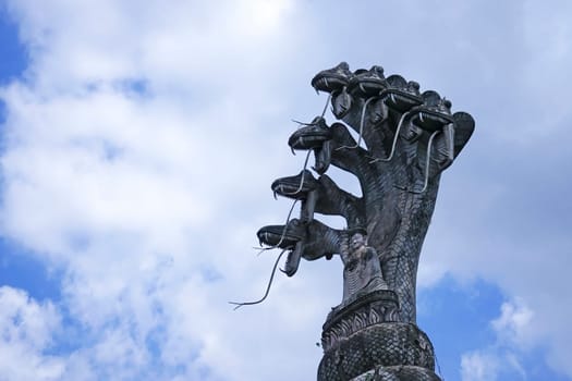 Buddhist figure made of stone,huge spiritual sculpture with seven snakes