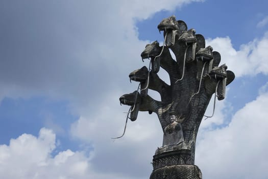 Buddhist figure made of stone,huge spiritual sculpture with seven snakes