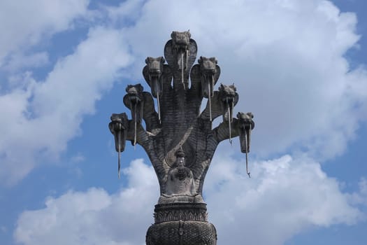 Buddhist figure made of stone,huge spiritual sculpture with seven snakes