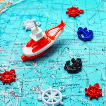 Map of the sea,the toy boat and marine characters on journey