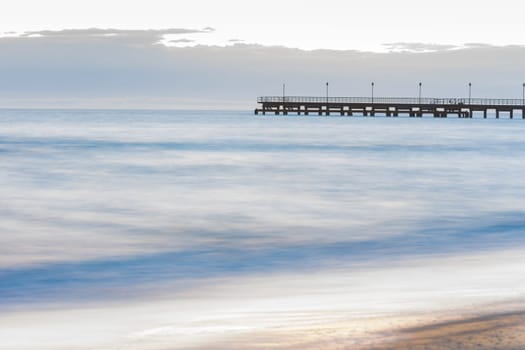 The seashore overlooking the marina after sunset, photographed with a long exposure
