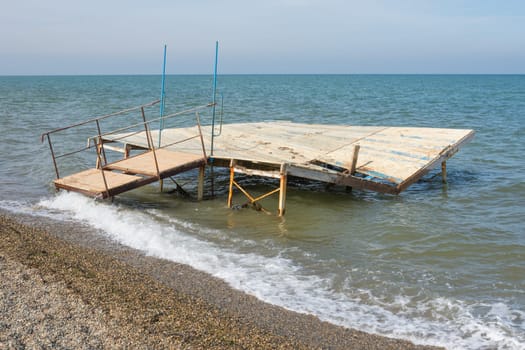 Break a small wooden pier on the seashore