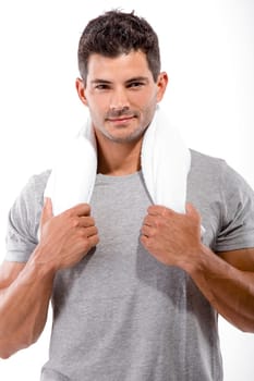 Portrait of a athletic man after doing exercises and holding a bottle of water, isolated over a white background