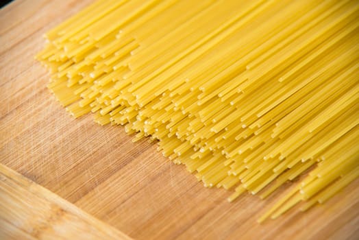 bunch of spaghetti on wood background