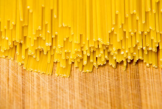 Bunch of spaghetti on wood background