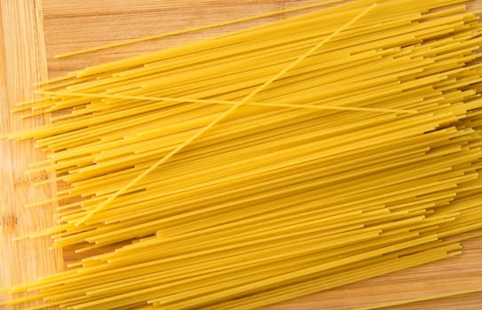 bunch of spaghetti on wood background