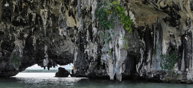 Sea cave of limestone island in Phang Nga Bay National Park, Thailand. The popular tourist destination for canoeing or kayaking
