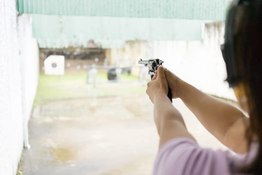 Women practicing target shooting in the distance