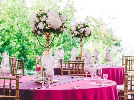 Beautiful dinner wedding table setting, summer outdoor