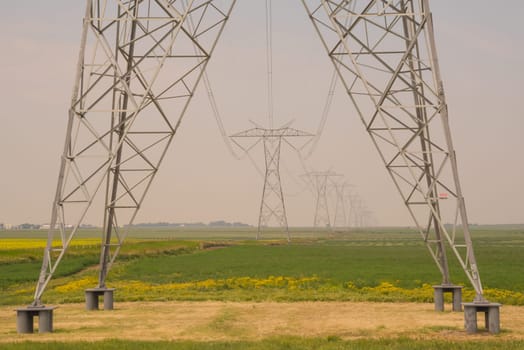 Landscape of HVDC Transmission Towers in Alberta Canada.