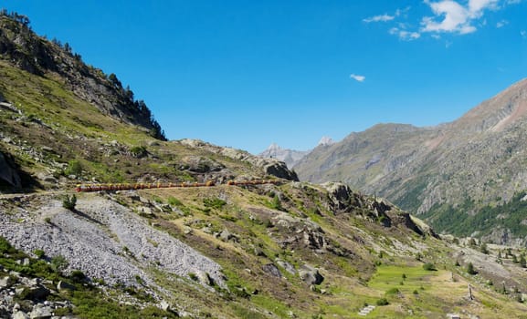train of Artouste with cliffs in the french mountains Pyrenees