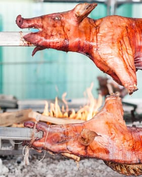 Baked roasted pork carcasses on the barbecue.