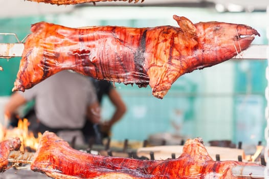 Baked roasted pork carcasses on the barbecue.