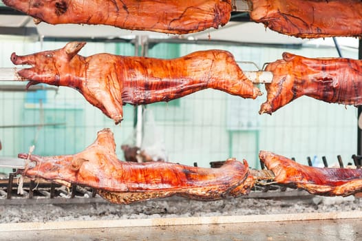 Baked roasted pork carcasses on the barbecue.