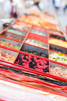 Assorted candies on outdoor Christmas Market.  Selective focus.