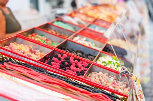 Assorted candies on outdoor Christmas Market.  Selective focus.