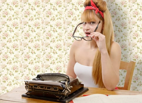 sexy young pinup girl with old typewriter