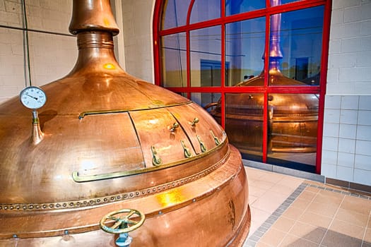 Traditional copper distillery tanks in a beer brewery