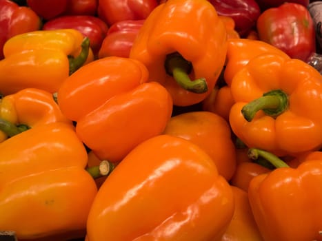 many orange pepper ready to sale on a big market