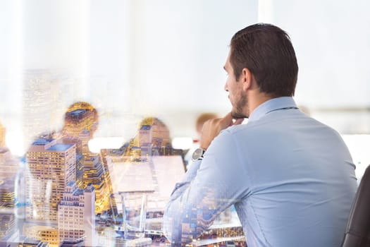 Corporate business meeting in office. Business executive giving instructions to his colleagues. Explaining business plans to employees. Business team concept. Business and Entrepreneurship.