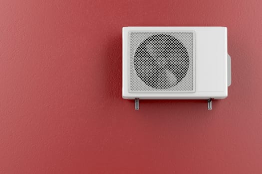 Air conditioner mounted on the red wall