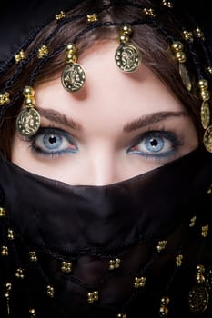 oriental blue eyed female with a scarf