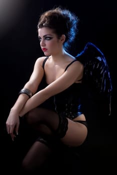 sensual woman in a costume in her knees