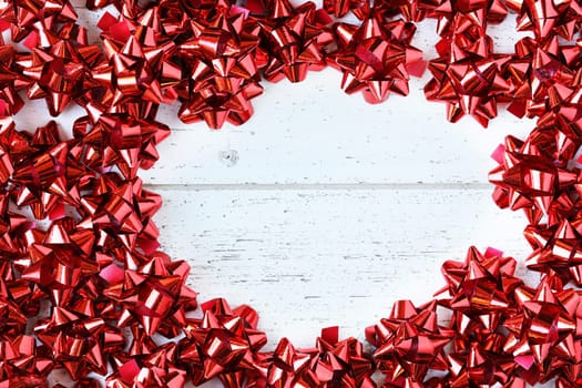 Many red decorative bows for Christmas or other gifts, with copy space.