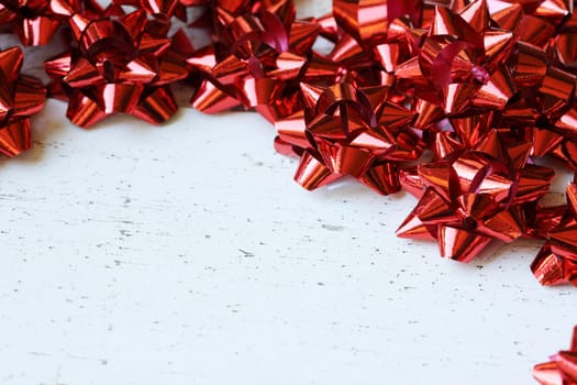 Many red decorative bows for Christmas or other gifts, with copy space.