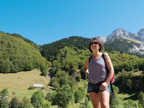 a mature woman hiker in mountains