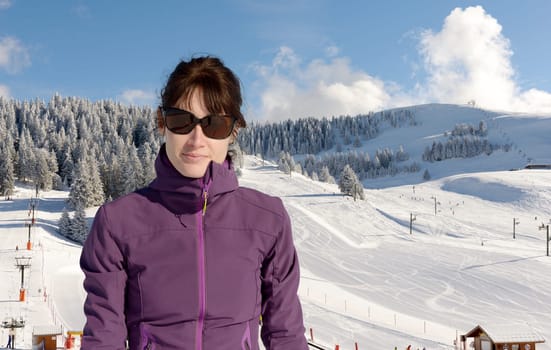 a young happy woman at winter skiing