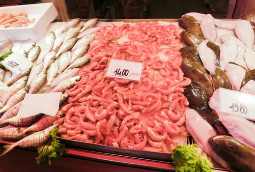 Venetian fish market - fish and prawns. The Rialto fish market is located alongside the Grand Canal near the Rialto Bridge - Venice, Italy