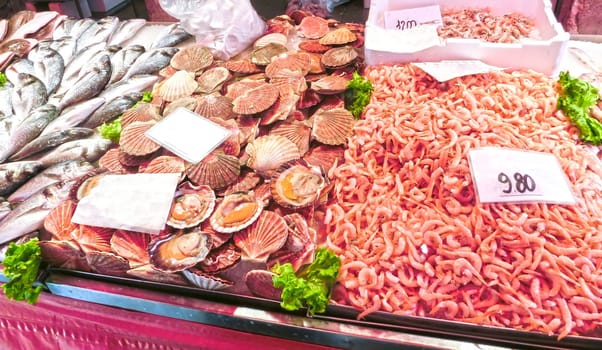 Venetian fish market - fish and prawns. The Rialto fish market is located alongside the Grand Canal near the Rialto Bridge - Venice, Italy