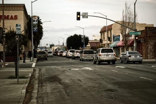 Salinas,United States - December 22,2015: Cars drive down the main and commercial street Monterey Street on December 22,2015 in Salinas.