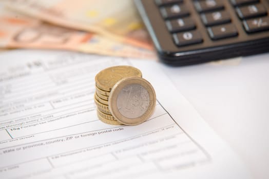 close up of euro currency. coins,banknotes and calculator