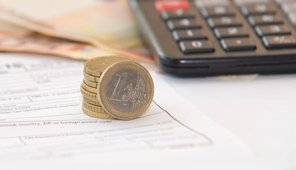 close up of euro currency. coins,banknotes and calculator