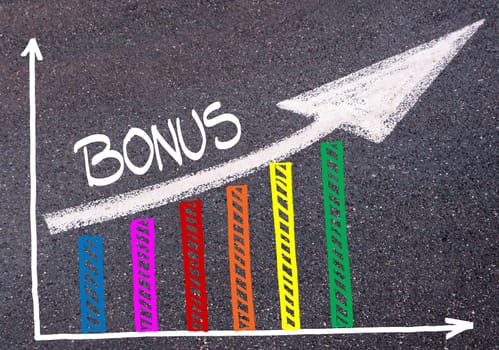 Colorful graph drawn over tarmac and word BONUS with directional arrow, business design concept